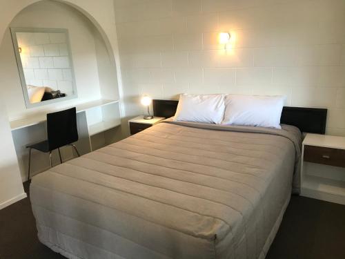 Ένα ή περισσότερα κρεβάτια σε δωμάτιο στο Motel Villa Del Rio