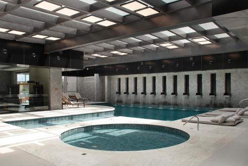 a large swimming pool with a large swimming pool at Exclusive Gramado Hotel & Spa by Gramado Parks in Gramado