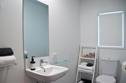 a bathroom with a sink and a toilet at Whakatane B&B in Whakatane