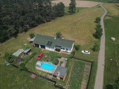 an aerial view of a house with a pool at Luxury Villa near Forest in Hlavice Czech Republic in Všelibice