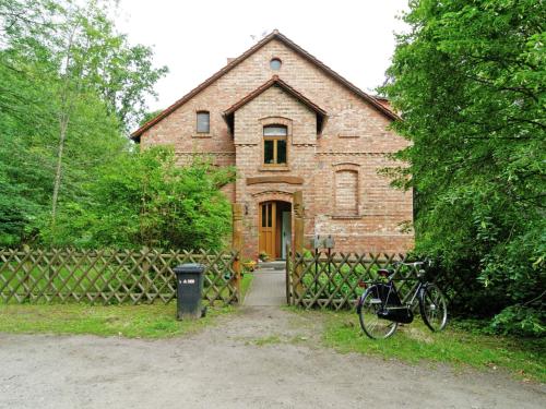 a brick house with a bike parked in front of it at Apartment with garden in F rstenwalde in Fürstenwalde-West