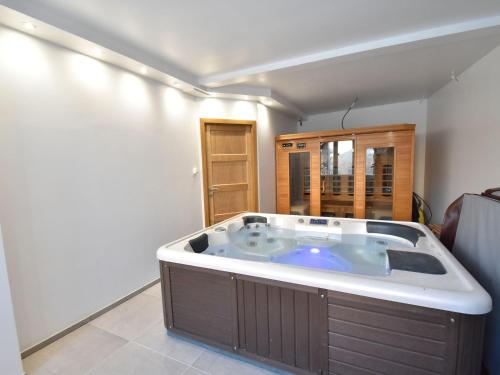 a large jacuzzi tub in a room at Holiday home with private heated pool in Villiers-les-Moines
