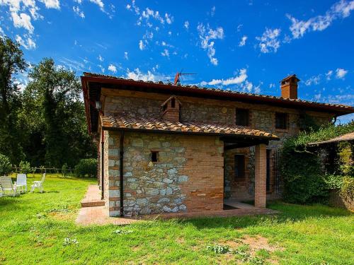 a small brick building with a roof on a field at Belvilla by OYO La Provincia in Sassa