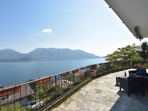a balcony with a view of a body of water at Belvilla by OYO Capriccio in Ghiffa