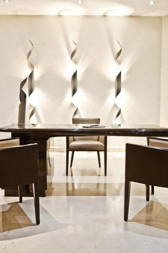 a dining room with a table and chairs at Hotel Borj Rabat - A member of Barceló Hotel Group in Rabat