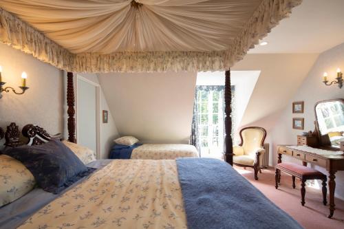 Krevet ili kreveti u jedinici u objektu Trelawn Riverside Cottages