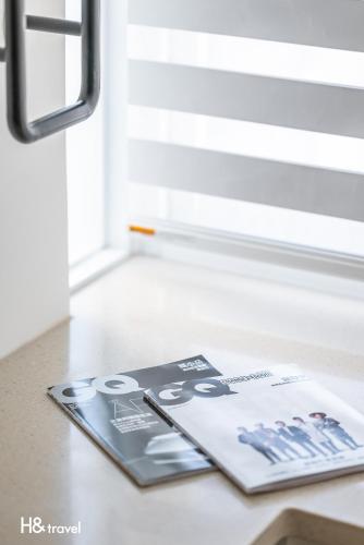 a magazine sitting on a table next to a window at Taitung Spring Homestay B&B in Taitung City