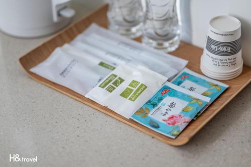 a wooden tray with products on top of a counter at Taitung Spring Homestay B&B in Taitung City