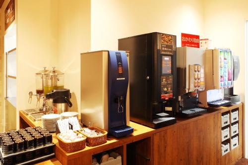 a coffee shop with a coffee machine on a counter at Hotel Sunriver Shimanto in Shimanto