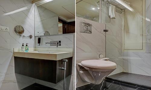 a bathroom with a toilet and a sink and a shower at The Onyx Hotel in Jamshedpur