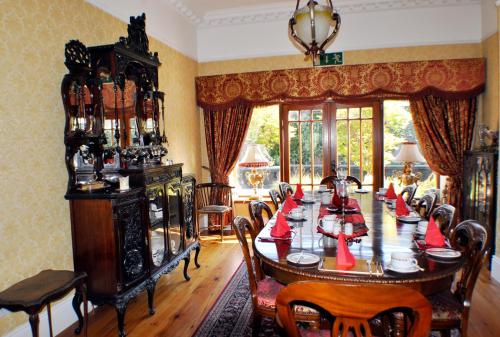 a dining room with a large table and chairs at Highfield House Guesthouse in Trim