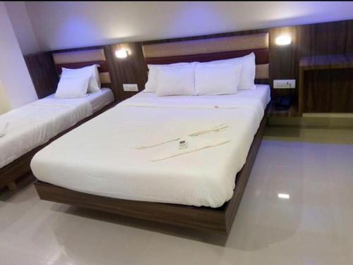 Un ou plusieurs lits dans un hébergement de l'établissement Hotel Castle Inn