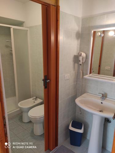 a bathroom with a toilet and a sink at Residenza La Ruina in Fenestrelle