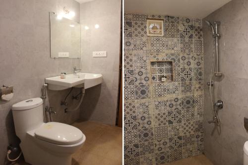 a bathroom with a toilet and a sink and a shower at Sea Breeze Inn, Calangute Goa in Calangute