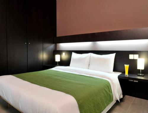 Postel nebo postele na pokoji v ubytování MINA Hotel Libreville