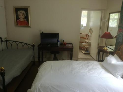 Ένα ή περισσότερα κρεβάτια σε δωμάτιο στο Valley Guest House