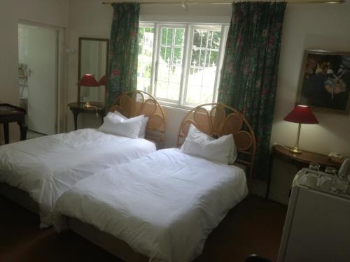 Ένα ή περισσότερα κρεβάτια σε δωμάτιο στο Valley Guest House