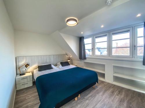 Postel nebo postele na pokoji v ubytování Prachtig Appartement dichtbij strand DO07