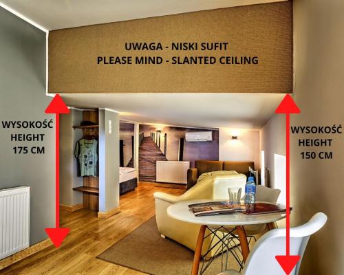 a view of a living room with two arrows pointing into a room at Stare Kino Cinema Residence in Łódź