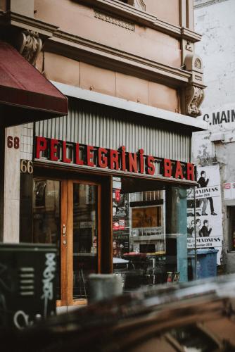 a restaurant with a sign on the front of a building at Lancemore Crossley St. Melbourne in Melbourne