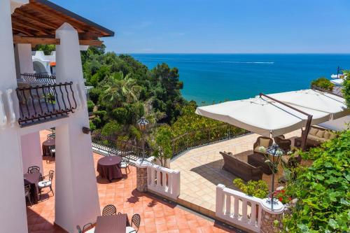 a view of the ocean from the balcony of a house at Grand Hotel Le Rocce in Gaeta