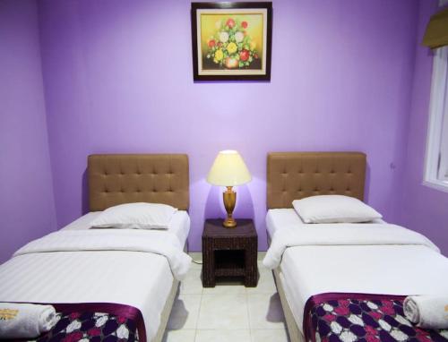 Ένα ή περισσότερα κρεβάτια σε δωμάτιο στο Hotel Signature Mandala Kencana