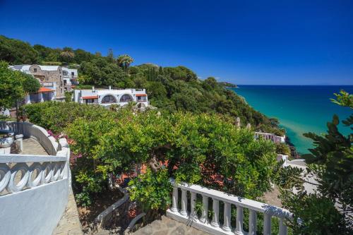 a view of the ocean from the balcony of a house at Grand Hotel Le Rocce in Gaeta