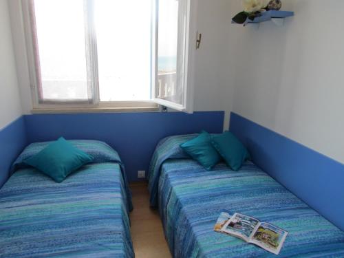 Ένα ή περισσότερα κρεβάτια σε δωμάτιο στο Condominio ZENITH