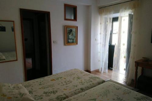 Ένα ή περισσότερα κρεβάτια σε δωμάτιο στο Apartamento Askanova