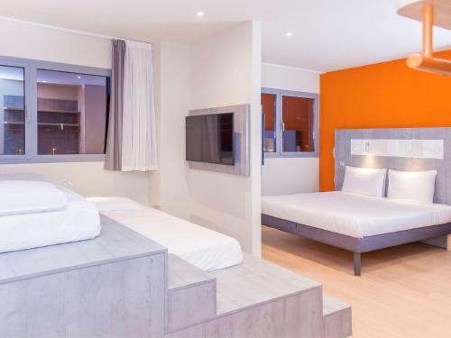 A bed or beds in a room at ibis budget Huerta De Murcia