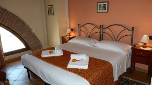 Postel nebo postele na pokoji v ubytování Agriturismo Ai Due Volti