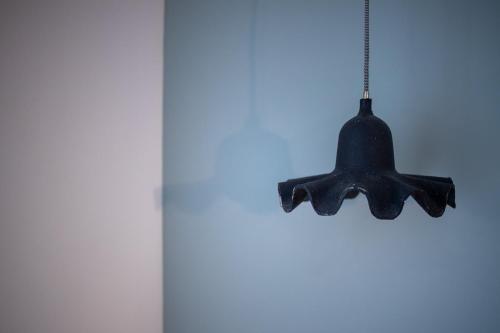 a black chandelier hanging from a ceiling at Kouros Exclusive Hotel & Suites - Adults Only in Faliraki