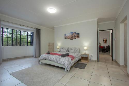 a bedroom with a large bed in a room at Shades of Nature in Marloth Park