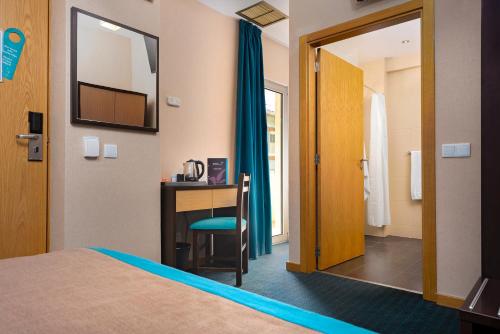 Letto o letti in una camera di Hotel DAH - Dom Afonso Henriques