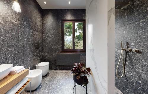 a bathroom with a toilet and a sink and a shower at Relais Villa Margherita in Longiano
