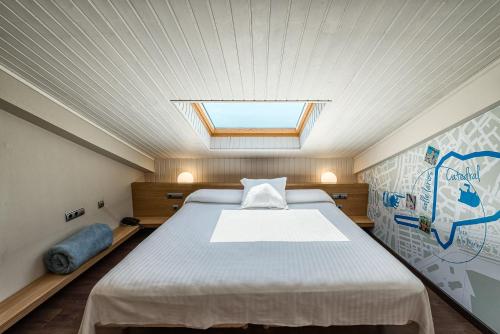 
Een bed of bedden in een kamer bij Hotel La Chancla
