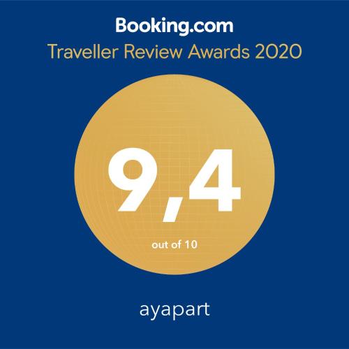 a sign that reads traveler review awards with a yellow circle at ayapart in Ayamonte
