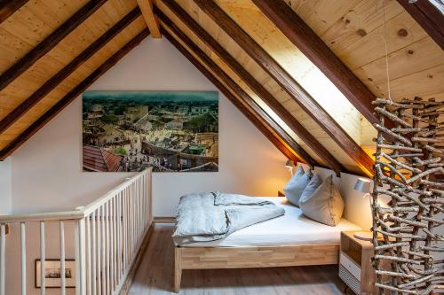 a bedroom with a bed in a attic at GMOAHOUSE in Oggau