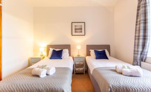 Un pat sau paturi într-o cameră la East Linton 4 Bedroom Cottage