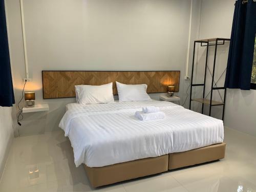 מיטה או מיטות בחדר ב-Putan-namsai Resort