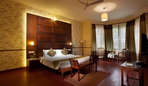 Ένα ή περισσότερα κρεβάτια σε δωμάτιο στο Ama Plantation Trails Coorg