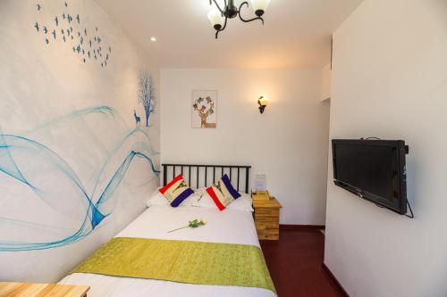 Boyi Apartment - Shanghai National Convention and Exhibition Center Branchにあるベッド