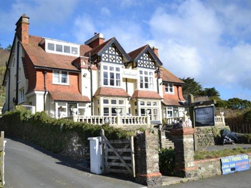 a large house on the side of a street at The Sandrock Lynton in Lynton