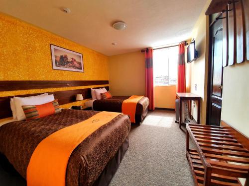 Postel nebo postele na pokoji v ubytování Vita Hoteles Colca
