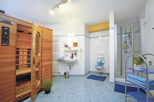 a bathroom with a shower and a sink and a toilet at Appartement Dertnig in Flachau