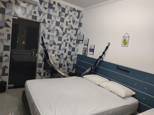 Cama ou camas em um quarto em Riviera de São Lourenço - Flat Amarilis