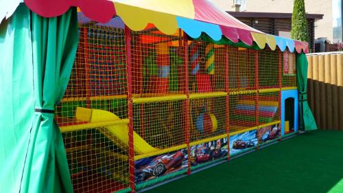 a toy play area with a tent and cars in it at Спа-Готель Потоки Хауз in Kam”yani Potoky