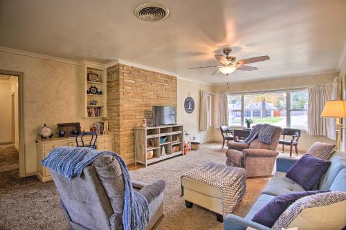 a living room with a couch and chairs at Ranch-Style Cottage - 2 Miles to Philbrook Museum! in Tulsa