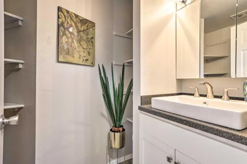 a bathroom with a sink and a mirror at Duplex with Private Yard 3 Mi to Downtown Loveland! in Loveland