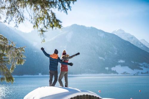 a group of people standing on top of a snow covered mountain at Hotel Central - das kleine Boutique Hotel am Achensee in Pertisau